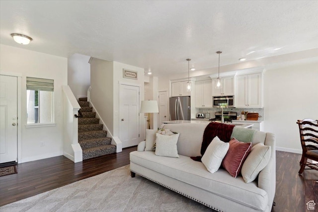 756 Spring Pond Dr, Farmington, UT 84025 - living area featuring wood finished floors, stairs, and recessed lighting