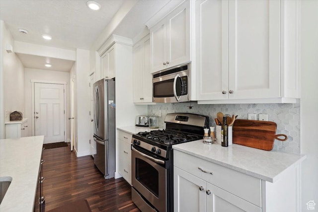 756 Spring Pond Dr, Farmington, UT 84025 - kitchen featuring appliances with stainless steel finishes, decorative backsplash, dark wood-style floors, white cabinetry, and recessed lighting