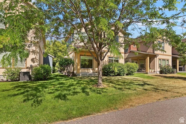 756 Spring Pond Dr, Farmington, UT 84025 - view of front of house with stucco siding and a front yard
