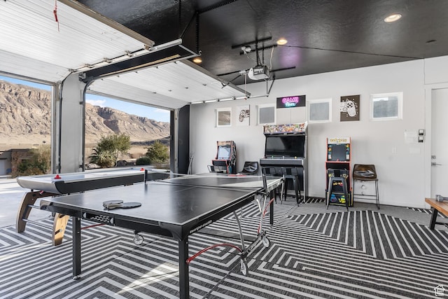 4582 S 1500 W, Hurricane, UT 84737 - rec room with a mountain view, carpet flooring, a garage, and recessed lighting
