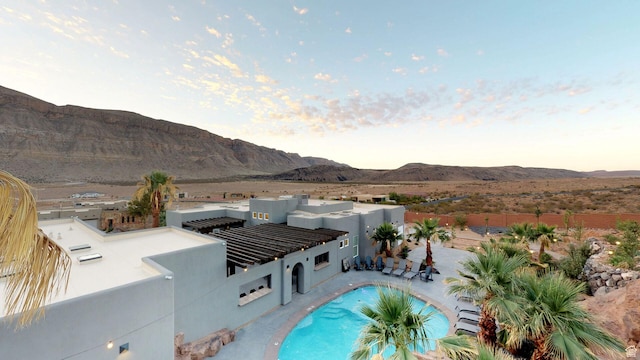 4582 S 1500 W, Hurricane, UT 84737 - pool at dusk with a mountain view and a patio area