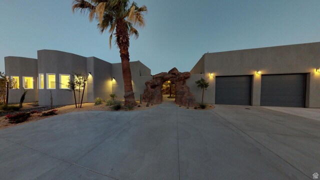4582 S 1500 W, Hurricane, UT 84737 - southwest-style home with concrete driveway, an attached garage, and stucco siding