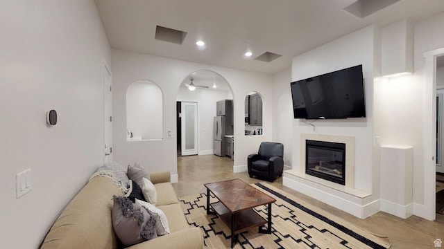 4582 S 1500 W, Hurricane, UT 84737 - living room featuring concrete flooring, a high end fireplace, and recessed lighting
