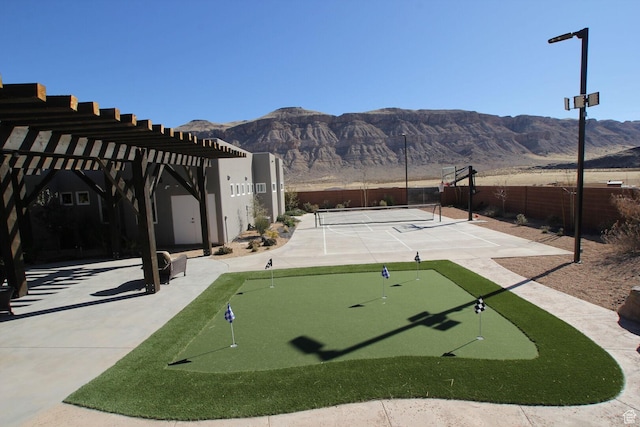 4582 S 1500 W, Hurricane, UT 84737 - view of property's community with a putting green, a mountain view, and a tennis court