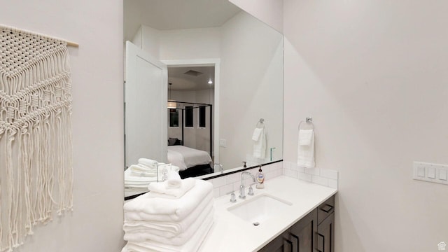 4582 S 1500 W, Hurricane, UT 84737 - bathroom featuring vanity, ensuite bath, and backsplash
