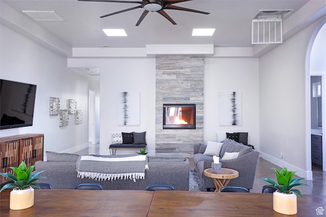 4582 S 1500 W, Hurricane, UT 84737 - living area with a ceiling fan, a stone fireplace, and arched walkways