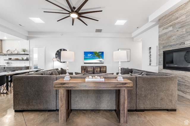 4582 S 1500 W, Hurricane, UT 84737 - living room featuring a ceiling fan and concrete flooring