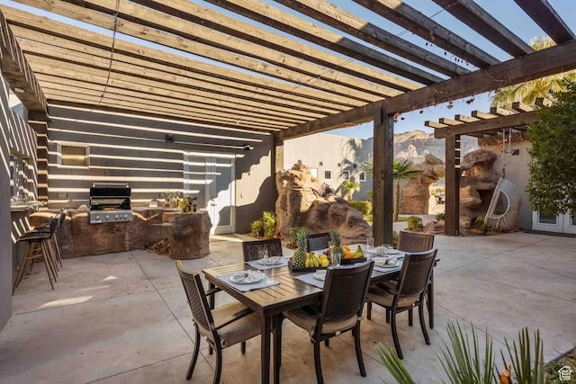 4582 S 1500 W, Hurricane, UT 84737 - view of patio featuring exterior kitchen, a pergola, outdoor dining space, and french doors