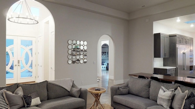 4582 S 1500 W, Hurricane, UT 84737 - living room featuring arched walkways and a chandelier