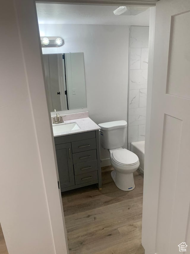 575 40th St, Ogden, UT 84403 - bathroom with wood finished floors and vanity
