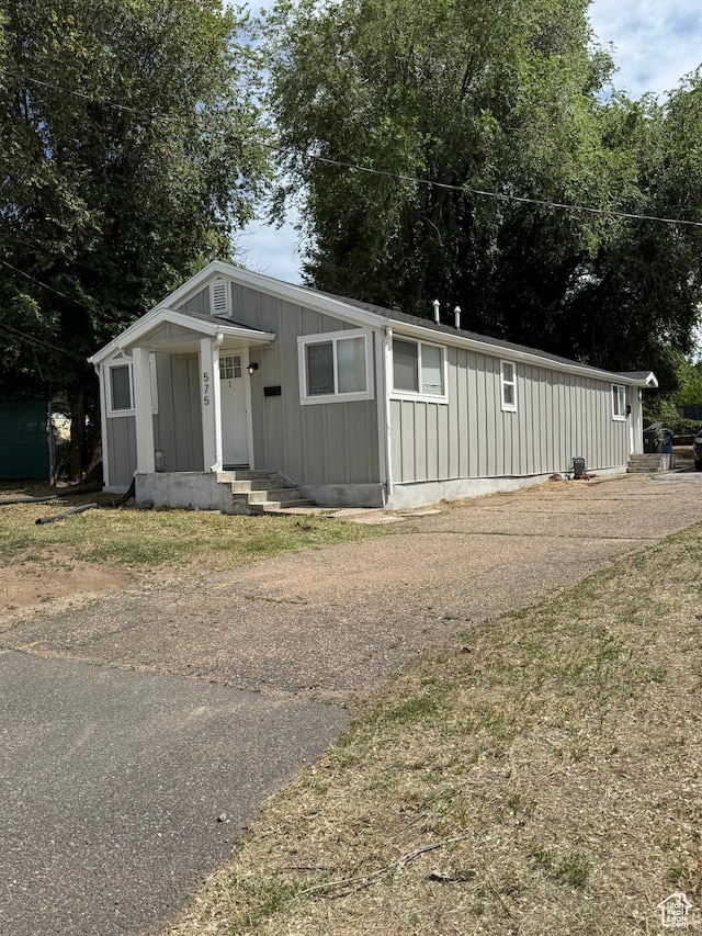 575 40th St, Ogden, UT 84403 - view of front facade with board and batten siding