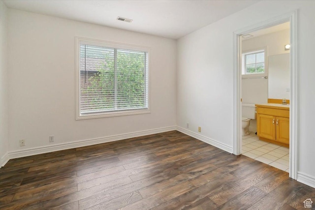 3181 E Deer Creek Cir, Cottonwood Heights, UT 84121 - unfurnished bedroom featuring wood finished floors and ensuite bath