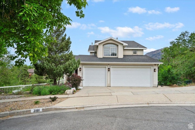 3181 E Deer Creek Cir, Cottonwood Heights, UT 84121 - traditional home featuring stucco siding, a garage, driveway, and a shingled roof