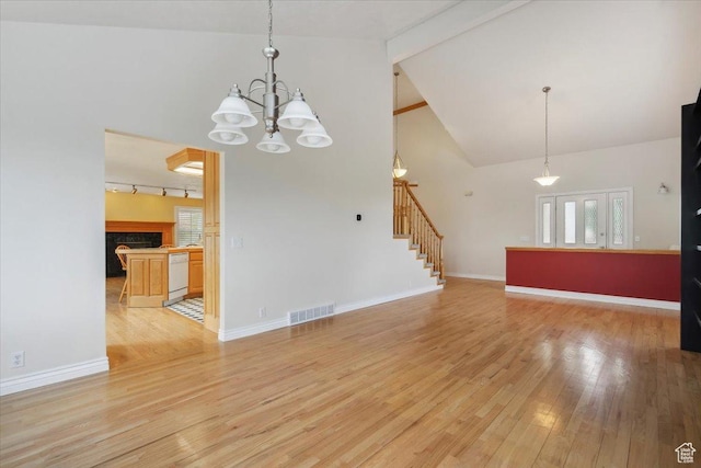 3181 E Deer Creek Cir, Cottonwood Heights, UT 84121 - unfurnished living room featuring light wood finished floors, a chandelier, beam ceiling, stairway, and high vaulted ceiling