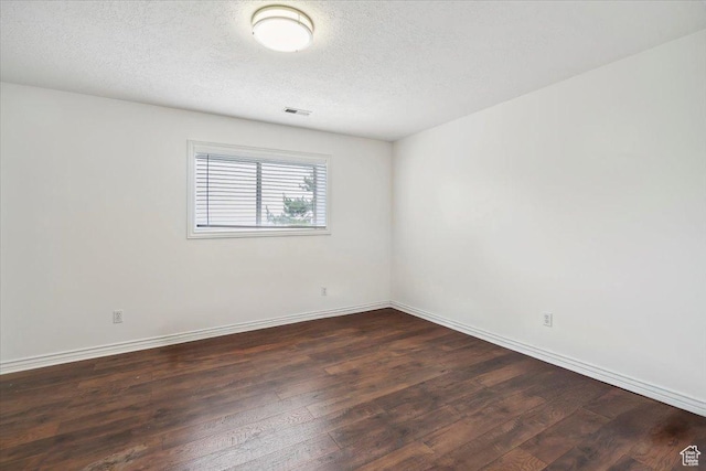 3181 E Deer Creek Cir, Cottonwood Heights, UT 84121 - spare room with dark wood-type flooring and a textured ceiling