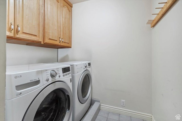 3181 E Deer Creek Cir, Cottonwood Heights, UT 84121 - washroom featuring washing machine and clothes dryer, light tile patterned flooring, and cabinet space