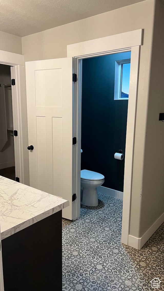 539 S Chan Dr, Grantsville, UT 84029 - bathroom with vanity and a textured ceiling