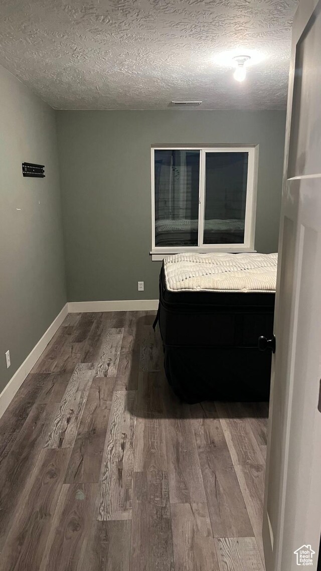 539 S Chan Dr, Grantsville, UT 84029 - empty room with a textured ceiling and wood finished floors