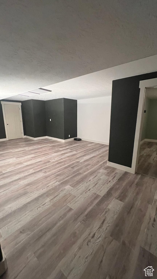 539 S Chan Dr, Grantsville, UT 84029 - basement with wood finished floors and a textured ceiling