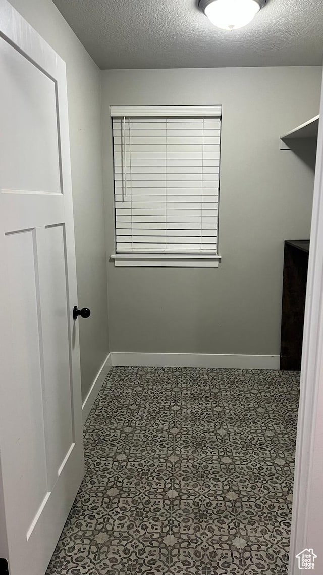 539 S Chan Dr, Grantsville, UT 84029 - spacious closet featuring tile patterned floors