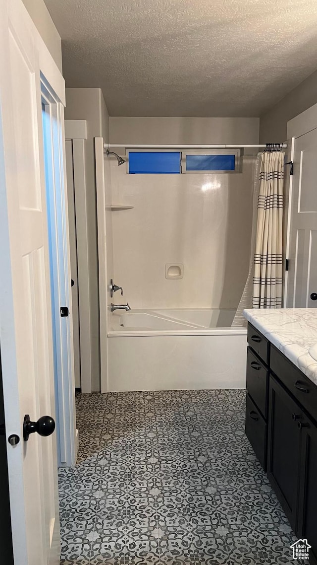 539 S Chan Dr, Grantsville, UT 84029 - bathroom with a textured ceiling, shower / bath combo, and vanity