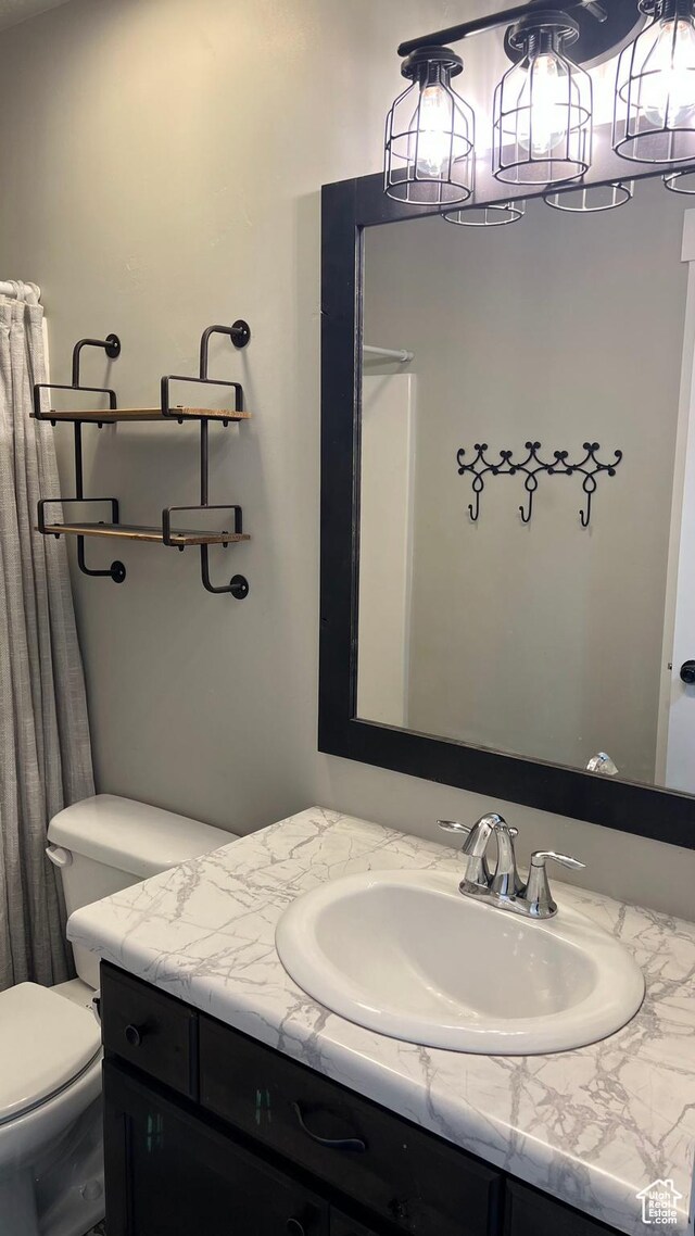 539 S Chan Dr, Grantsville, UT 84029 - full bathroom featuring vanity and toilet