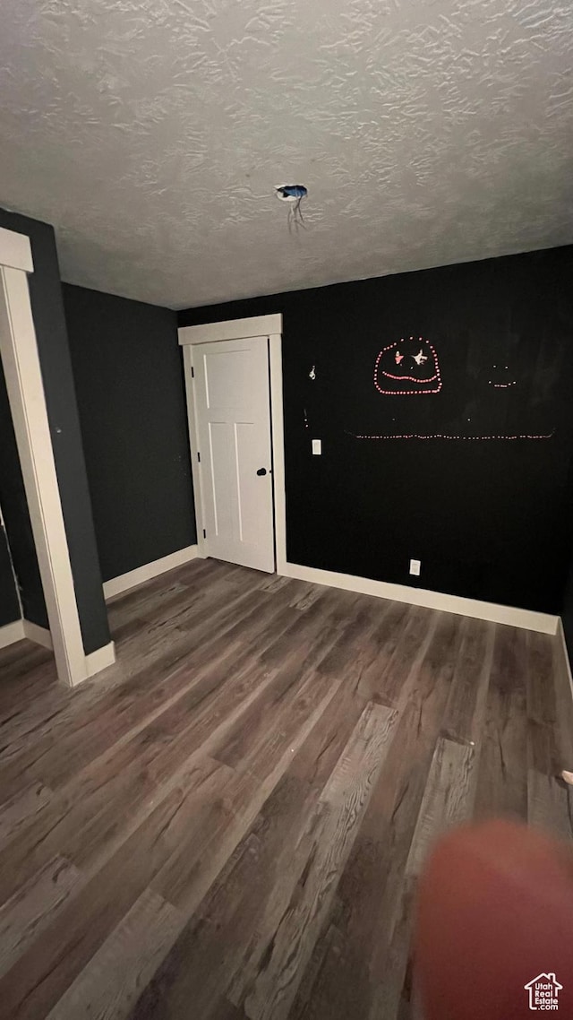 539 S Chan Dr, Grantsville, UT 84029 - unfurnished room featuring wood finished floors and a textured ceiling
