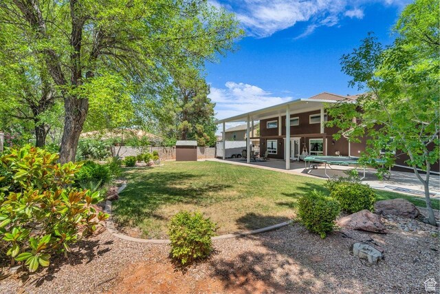 2119 Blair Cir, Santa Clara, UT 84765 - view of yard with a storage unit and a patio