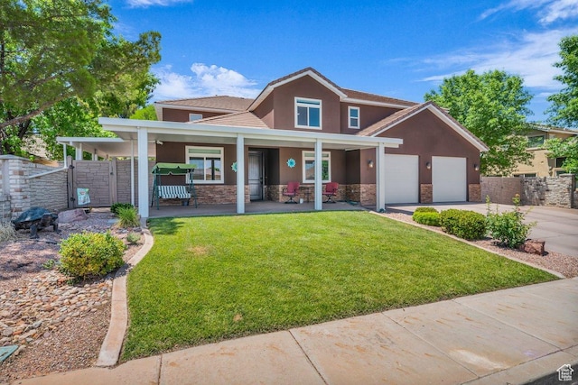 2119 Blair Cir, Santa Clara, UT 84765 - view of front of home with stucco siding, stone siding, driveway, an attached garage, and covered porch