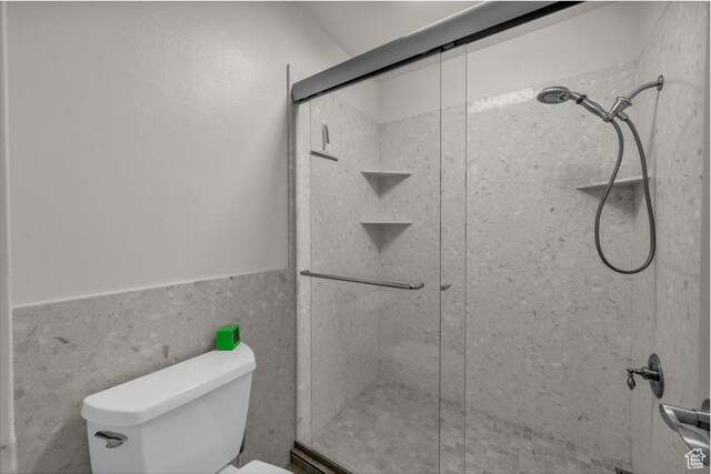 2119 Blair Cir, Santa Clara, UT 84765 - bathroom with a stall shower and a wainscoted wall