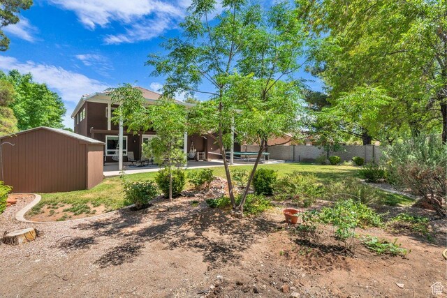 2119 Blair Cir, Santa Clara, UT 84765 - view of yard featuring a patio and a shed