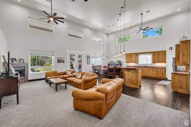 2119 Blair Cir, Santa Clara, UT 84765 - living area featuring ceiling fan, recessed lighting, a towering ceiling, healthy amount of natural light, and a fireplace