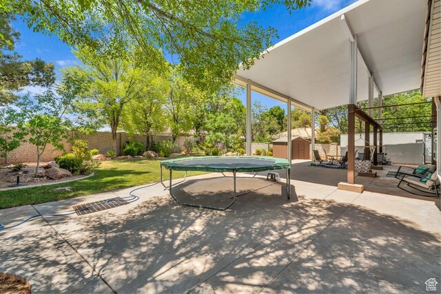 2119 Blair Cir, Santa Clara, UT 84765 - fenced backyard with a storage unit and a patio area