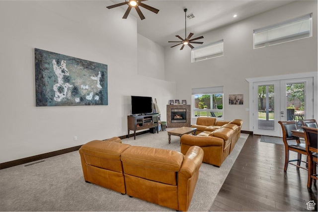 2119 Blair Cir, Santa Clara, UT 84765 - living area featuring a ceiling fan, a high ceiling, wood finished floors, french doors, and a tile fireplace