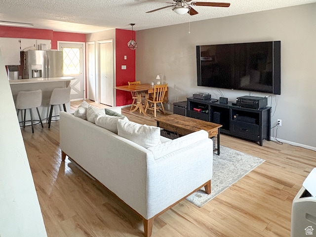 101 N 1850 W Unit 35, Cedar City, UT 84720 - living room with ceiling fan, a textured ceiling, and light wood-type flooring