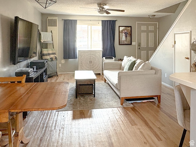 101 N 1850 W Unit 35, Cedar City, UT 84720 - living room featuring ceiling fan, light wood-style flooring, and a textured ceiling