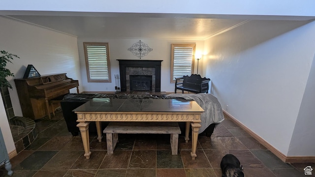 1584 E Petunia Way, Sandy, UT 84092 - dining area with stone tile flooring, ornamental molding, and a tiled fireplace