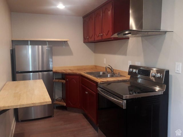 1584 E Petunia Way, Sandy, UT 84092 - kitchen featuring wall chimney range hood, range with electric cooktop, freestanding refrigerator, and wood finished floors