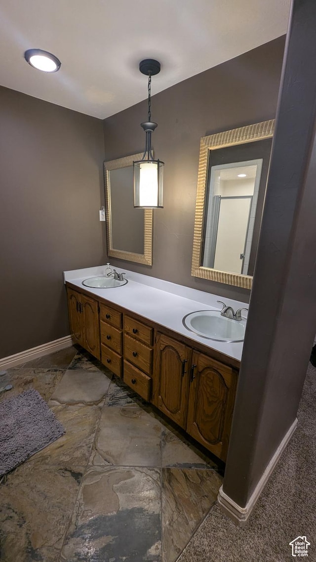 1584 E Petunia Way, Sandy, UT 84092 - bathroom featuring double vanity and baseboards