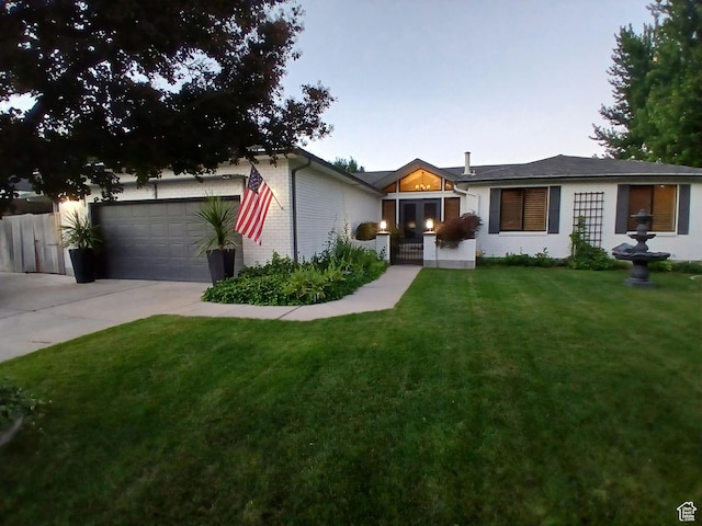 1584 E Petunia Way, Sandy, UT 84092 - view of front of house with driveway, a garage, and brick siding