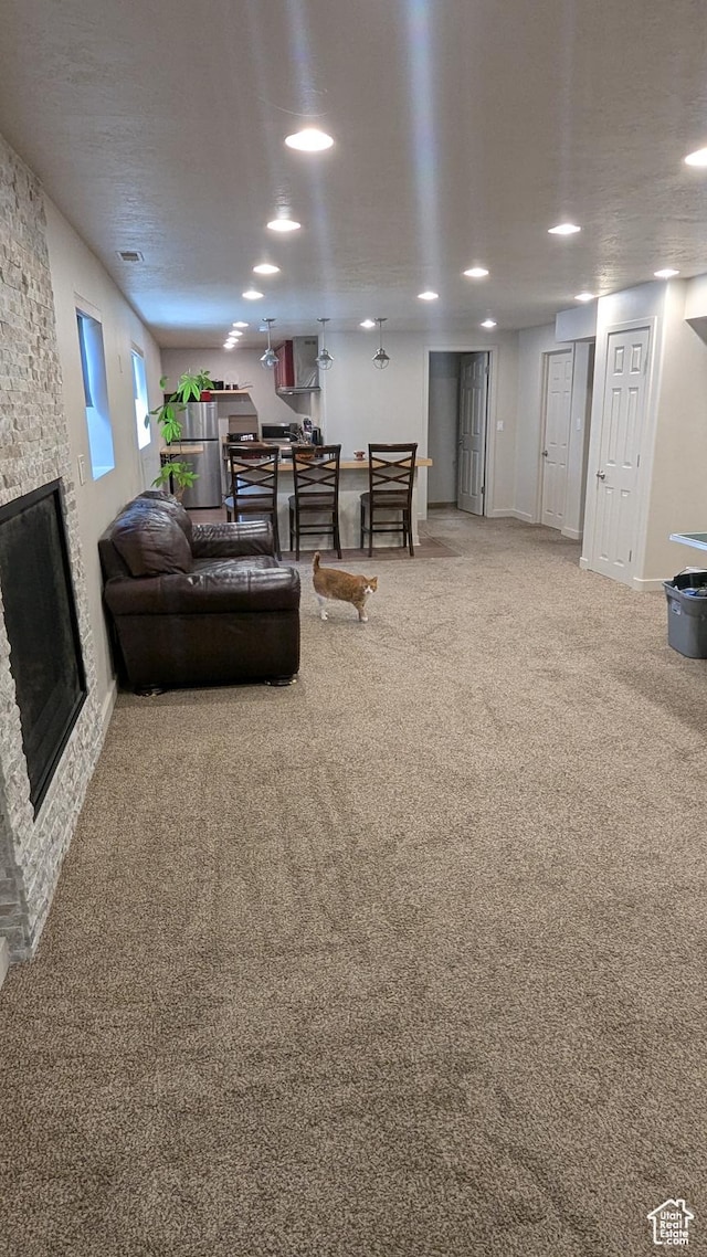 1584 E Petunia Way, Sandy, UT 84092 - carpeted living area with a fireplace and baseboards