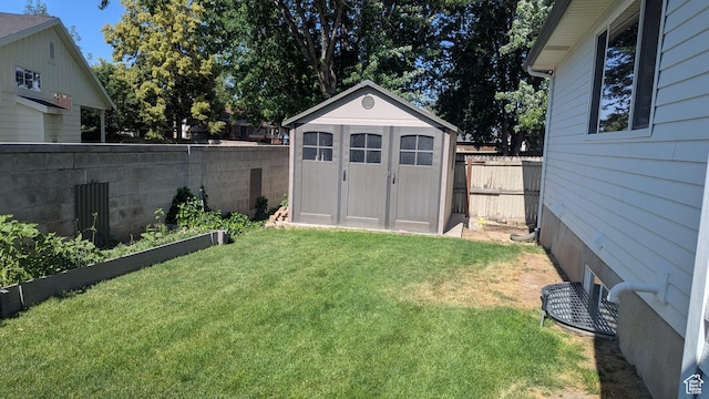 1584 E Petunia Way, Sandy, UT 84092 - fenced backyard featuring a storage unit