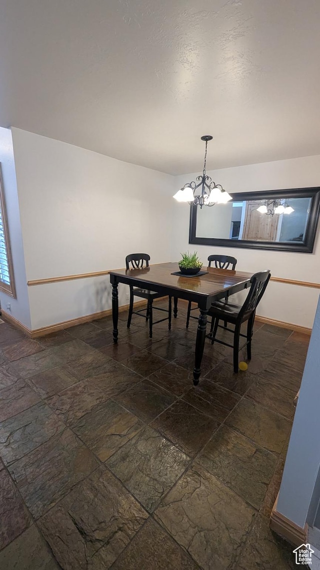 1584 E Petunia Way, Sandy, UT 84092 - dining area with stone tile floors and a chandelier
