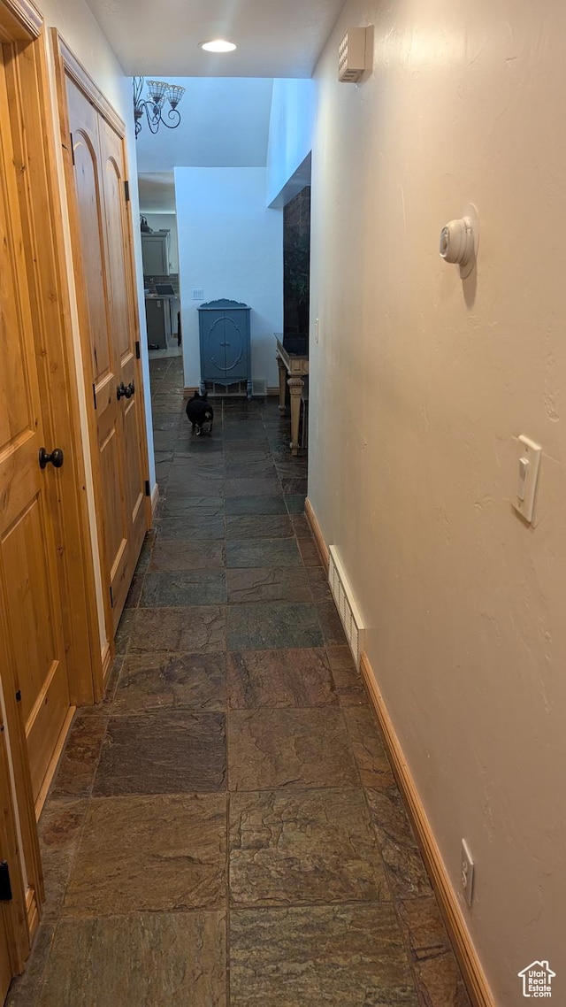 1584 E Petunia Way, Sandy, UT 84092 - corridor with baseboards and dark stone finish flooring