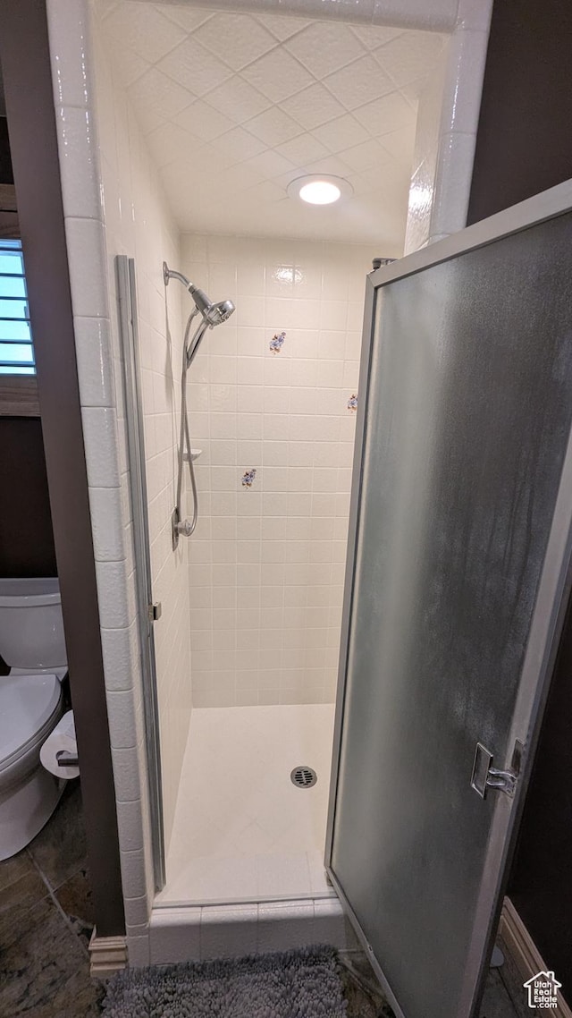 1584 E Petunia Way, Sandy, UT 84092 - full bathroom featuring a stall shower and toilet