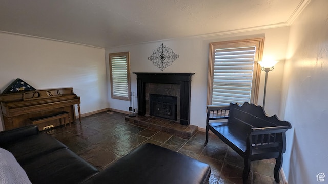 1584 E Petunia Way, Sandy, UT 84092 - living room featuring stone tile flooring, a glass covered fireplace, and crown molding