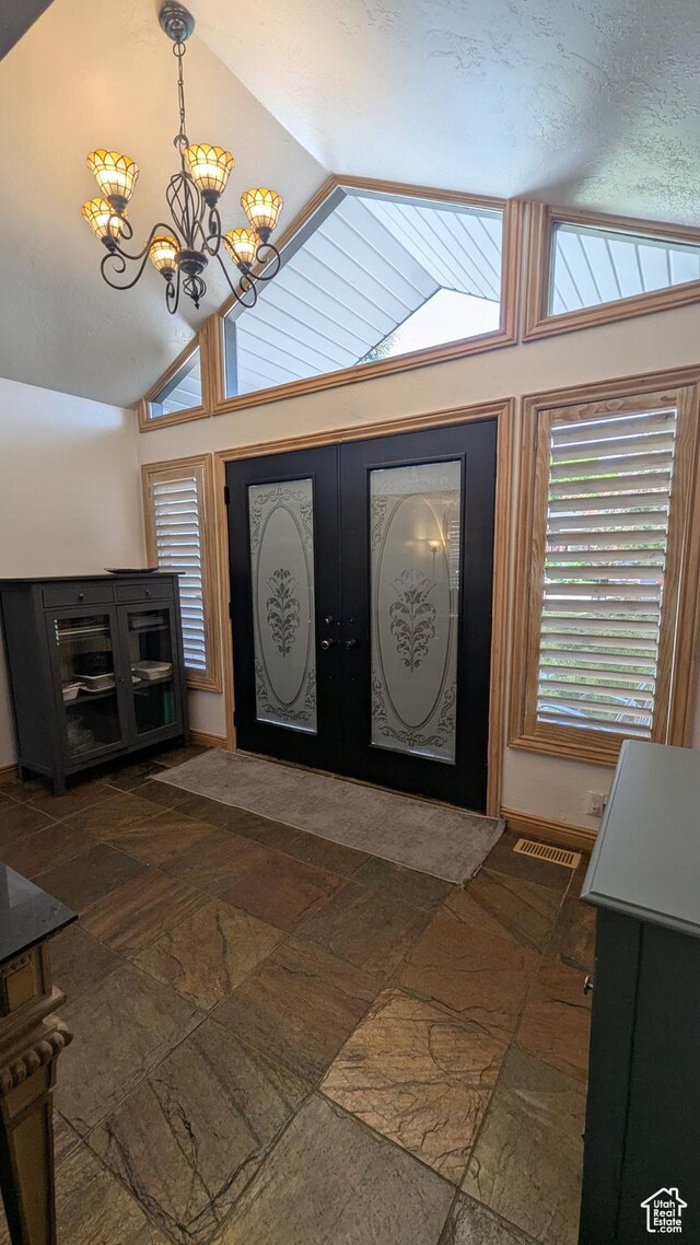 1584 E Petunia Way, Sandy, UT 84092 - entryway featuring lofted ceiling, a chandelier, and french doors