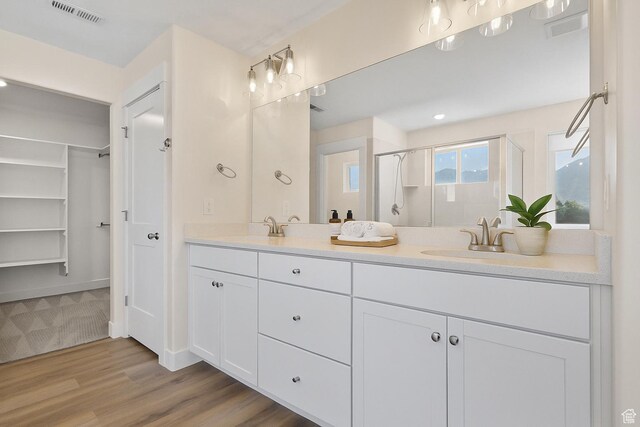 181 W 580 S, Orem, UT 84058 - full bath with double vanity, a stall shower, wood finished floors, and a spacious closet