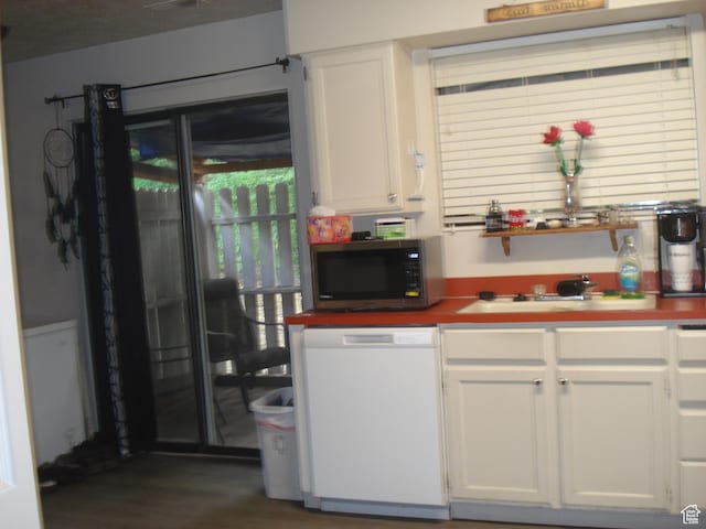 281 E 7th St S Unit 8, Ogden, UT 84404 - kitchen featuring dishwasher, stainless steel microwave, white cabinets, and dark wood-style flooring