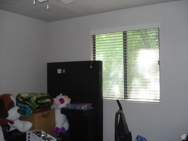 281 E 7th St S Unit 8, Ogden, UT 84404 - bedroom with multiple windows and a textured ceiling